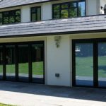 "Family enjoying energy-efficient aluminium windows by Flashglass Industry"