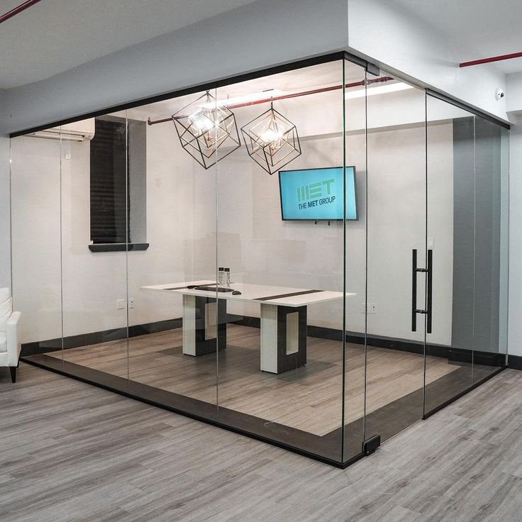 "Frameless glass partitions in a modern office by Flashglass Industry"